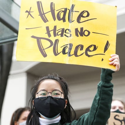 A protester holds a sign that reads “hate has no place” during the We Are Not Silent rally organised by the Asian-American Pacific Islander (AAPI) Coalition Against Hate and Bias in Bellevue, Washington, on Thursday. Photo: AFP