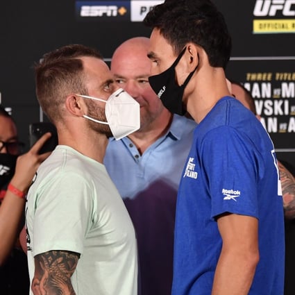 Alexander Volkanovski (left) and Max Holloway face off during the UFC 251 official weigh-in inside Flash Forum in Abu Dhabi. Photos: Jeff Bottari/Zuffa LLC