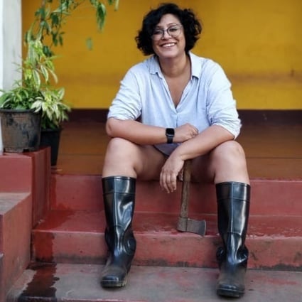 Ruchira Bose, who left Mumbai for Goa last year, sits on the steps of her new home. Photo: Suranjana Ghosh