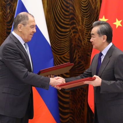 Russian Foreign Minister Sergey Lavrov (left) shakes hands with his Chinese counterpart Wang Yi in Guilin on Tuesday. Photo: Reuters
