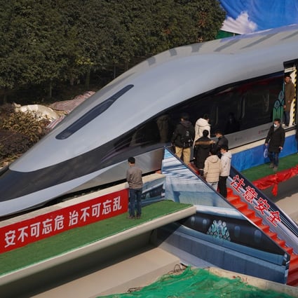 People visit a prototype of China’s new superfast maglev train in Chengdu in January. Photo: AFP