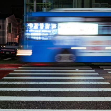 A bus rushes past a pedestrian crossing in Seoul. Photo: Shutterstock