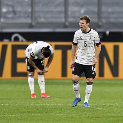 Germany’s Joshua Kimmich (centre) reacts after Germany concedes a second goal during the World Cup 2022 group J qualifying match against North Macedonia. Photo: AP