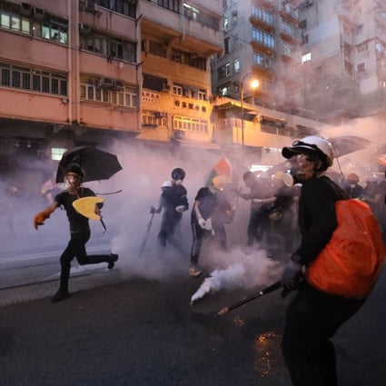 Riot police fire tear gas at anti-extradition bill protesters in Sai Ying Pun, Hong Kong, July 2019. Photo: Felix Wong