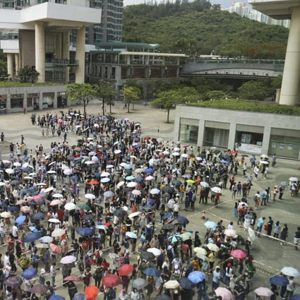 People queue on Saturday at a mobile specimen collection station in Tung Chung set up for people subject to compulsory testing orders. Photo: May Tse