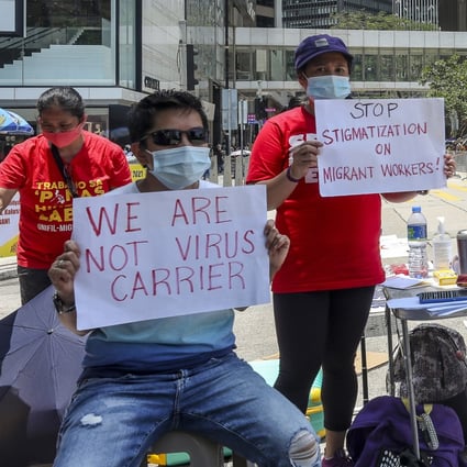 Foreign domestic helpers petition against the new rules mandating blanket Covid-19 testing and vaccinations on Chater Road in Central, Hong Kong, on May 1. Photo: Xiaomei Chen