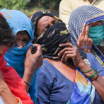 Relatives grieve as they arrive for the cremation of their loved one in Moradabad on May 5, 2021. Photo: AFP
