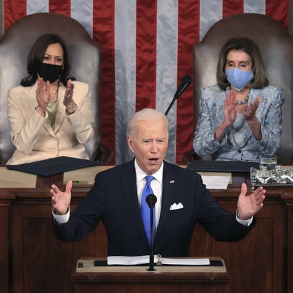 US President Joe Biden addresses a joint session of Congress on April 28 in the House Chamber at the US Capitol in Washington as Vice-President Kamala Harris (left) and House Speaker Nancy Pelosi look on. Photo: AP