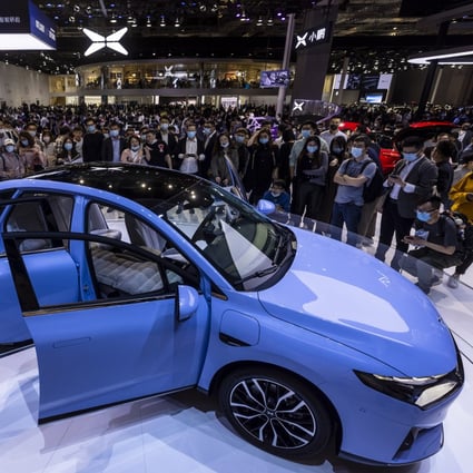 Visitors look at the Xpeng P5 car at the Auto Shanghai 2021 motor show in Shanghai, China. Photo: EPA-EFE
