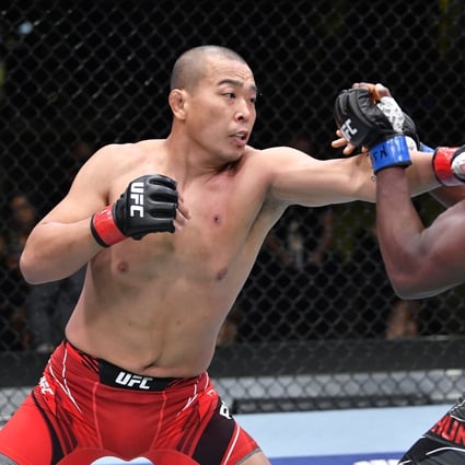Park Jun-yong Park of South Korea punches Tafon Nchukwi in their middleweight bout during the UFC Fight Night event on May 8, 2021 in Las Vegas, Nevada. Photos: Chris Unger/Zuffa LLC