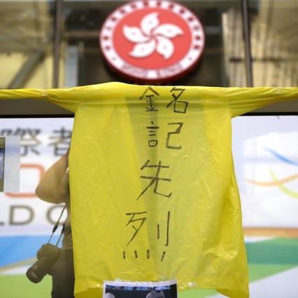 A yellow raincoat is displayed during a protest in 2019 to pay respect to Marco Leung. Photo: Winson Wong
