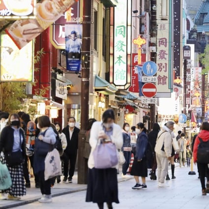 People wearing masks walk in Chinatown in Yokohama on April 15. Japan is experiencing a fourth wave of Covid-19 infections. Photo: Kyodo