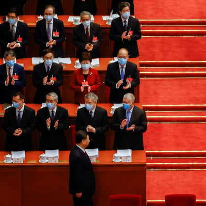 Hong Kong Chief Executive Carrie Lam Cheng Yuet-ngor and Chinese officials applaud as President Xi Jinping arrives for the opening session of the National People’s Congress at the Great Hall of the People in Beijing on March 5. Photo: Reuters