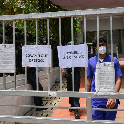 Signs announcing that vaccines are out of stock are seen at the entrance to a vaccination centre amid a shortage of vaccine supplies in Mumbai on April 30. Photo: AFP