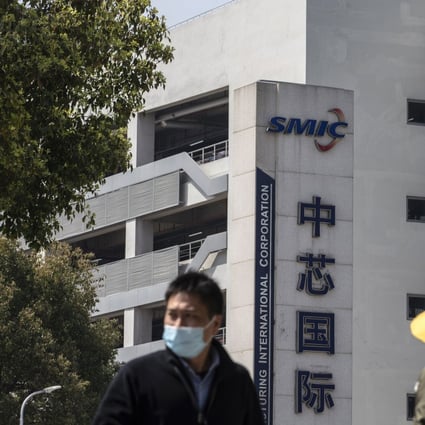 Pedestrians walk past SMIC headquarters in Shanghai, China, on Tuesday, March 23, 2021. Photo: Bloomberg