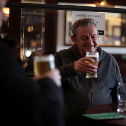 People drink beer at The Fox on the Hill pub in London on Monday as Covid-19 restrictions continue to ease in Britain. Photo: Reuters