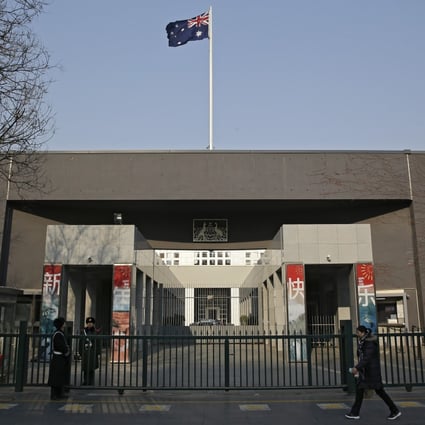 A woman walks by the Australian embassy in Beijing in January 2019. Citing Australian measures that “disrupt the normal exchanges and cooperation between China and Australia”, Beijing said last week it was indefinitely suspending high-level economic dialogue with Canberra. Photo: AP