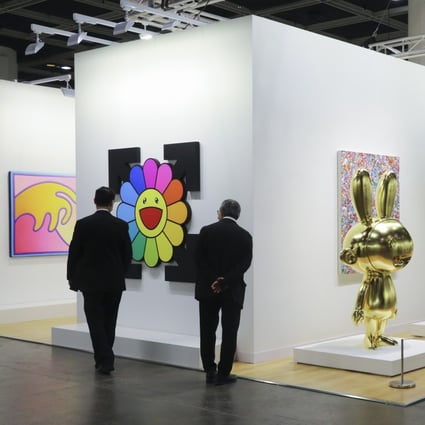Attendees look at art on display at a mini Art Basel Hong Kong held in November 2020 at the Hong Kong Convention and Exhibition Centre. The fair is back at the venue this week, with about half the usual number of galleries exhibiting art for sale. Photo: Dickson Lee