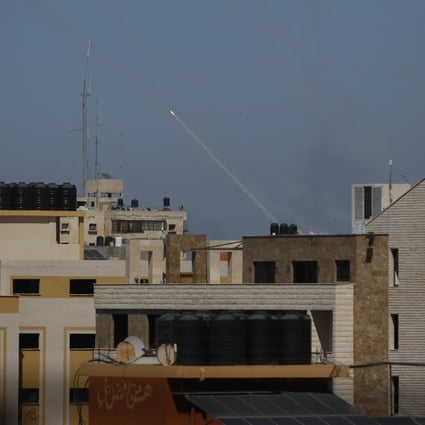 A rocket is launched from the Gaza Strip towards Israel on Wednesday. Photo: AP