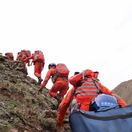 Rescuers search for victims at the scene of the tragedy in Gansu. Photo: Xinhua