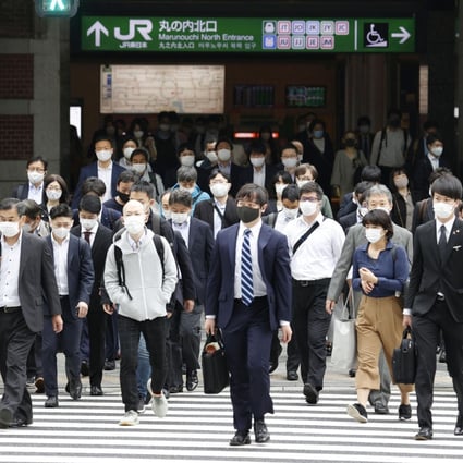 Commuters head out of Tokyo Station on May 6. In Asia, surveys conducted last year showed that most workers missed the social interaction that office life brings. Photo: Kyodo
