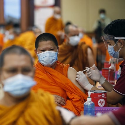Buddhist monks in Bangkok, Thailand, get a shot of the Sinovac vaccine. Photo: EPA