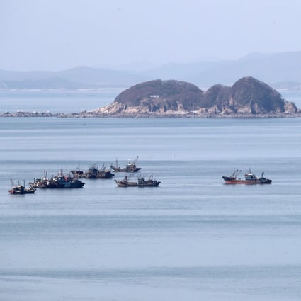 Some of the suspected illegal Chinese fishing boats, as viewed from Yeonpyeong Island. Photo: Yeonpyeong County