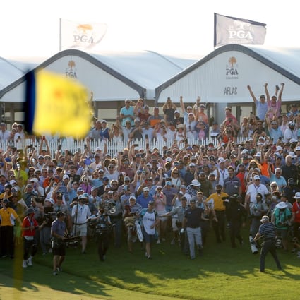 Phil Mickelson walks up the 18th fairway followed by a massive crowd at the conclusion of the 2021 PGA Championship. Photo: AFP