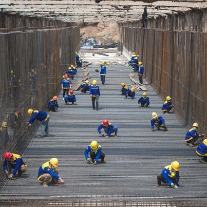 An increase in overdue payments in the construction sector coincided with rising bond defaults in mainland China last year, especially by heavily indebted state-backed companies in the construction and real estate sectors. Photo: Xinhua