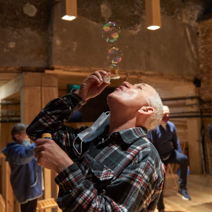 A man blows soap bubbles as part of therapy at the former Wieliczka Salt Mine Health Resort complex located in Wieliczka. Photo: AFP