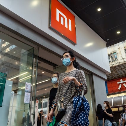 Pedestrians walk past a Xiaomi Corp store in Hong Kong on May 25, 2021. The Beijing-based company was ranked as the world’s third-biggest smartphone vendor in the quarter to March. Photo: Bloomberg