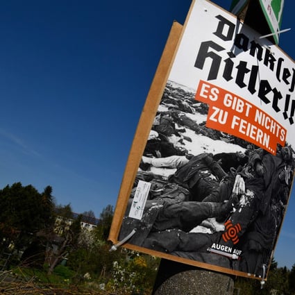 A placard reading “Thanks (to) Hitler! There is nothing to celebrate” and showing a historical photo of World War II dead stands at the outskirts of Goerlitz, in eastern Germany, on April 20, 2018, as hundreds of neo-Nazis prepare to congregate to mark Adolf Hitler’s birthday. Photo: AFP