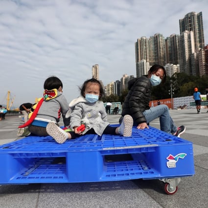 Adults and children enjoy a sunny day at Belcher Bay Promenade in Kennedy Town, Hong Kong. Photo: Xiaomei Chen