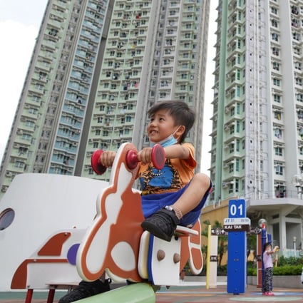A child plays outside a public housing estate in Kai Tak. The waiting time for a public housing flat in Hong Kong is nearly six years. Photo: Winson Wong