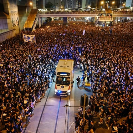 Protesters make way for an ambulance during a rally against a proposed extradition law in Hong Kong on June 16, 2019. Photo: AFP