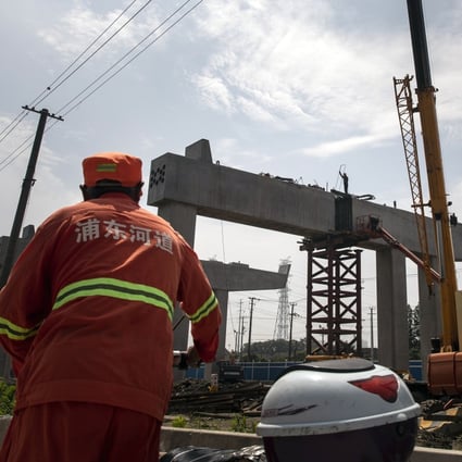 The construction site of an elevated highway on the outskirts of Shanghai. The pilot scheme, currently open to only infrastructure firms, will be expanded to other property sectors after the first Reits prove to be successful. Photo: Bloomberg
