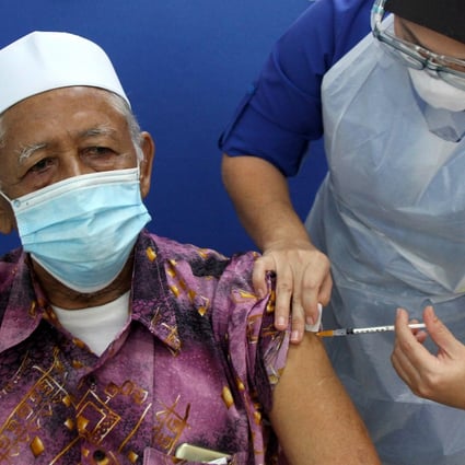 An elderly man receives a dose of the Sinovac Covid-19 vaccine at a local hospital in Ipoh, Malaysia, on June 1. The country has one of the highest coronavirus infection rates in the world. Photo: dpa