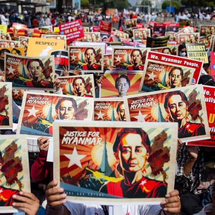 Protesters hold portraits of Myanmar’s ousted civilian leader Aung San Suu Kyi during a protest against the military coup. File photo