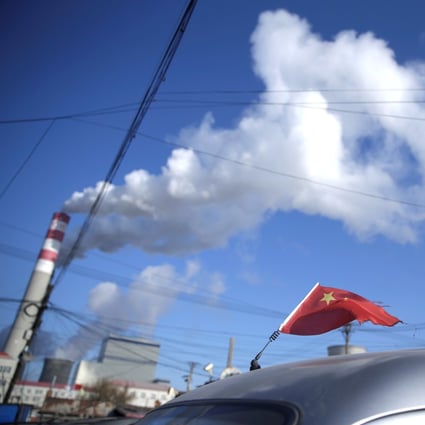 A Chinese flag on a car near a coal-fired power plant in Harbin in northernmost Heilongjiang province. Photo: Reuters