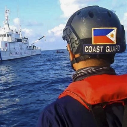 Members of the Philippine Coast Guard patrol at the Whitsun Reef in the South China Sea on April 14, 2021. Photo: Philippine Coast Guard via AP