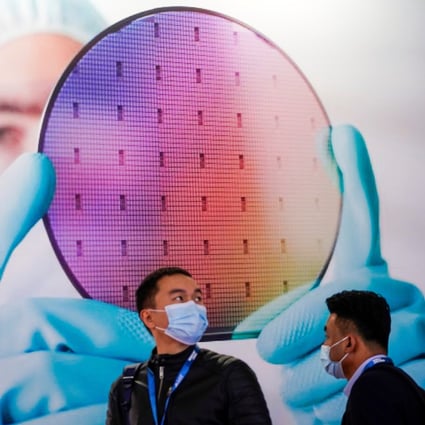 People visit a display of a semiconductor device at the Semicon China trade fair in Shanghai on March 17. The number of new chip-related companies in China rose threefold in the period January to May compared with the same period in 2020. Photo: Reuters