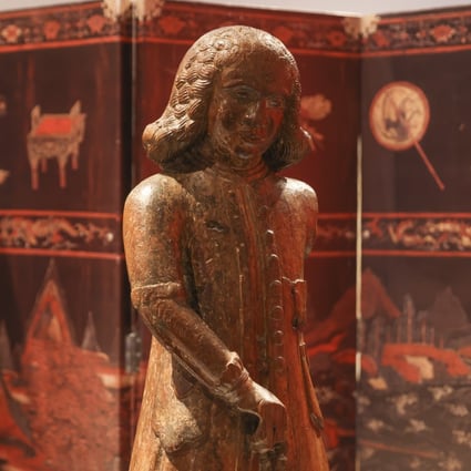 An 18th century carved wooden figure of a Dutch merchant shown as part of a new exhibition, Maritime Crossroads: Millenia of Global Trade in Hong Kong, at the Hong Kong Maritime Museum. Photo: Nora Tam