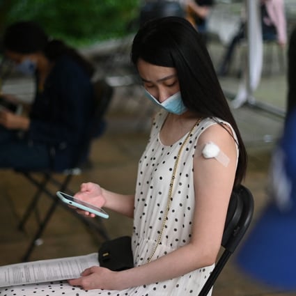 A student at a vaccination centre in London. Photo: AFP