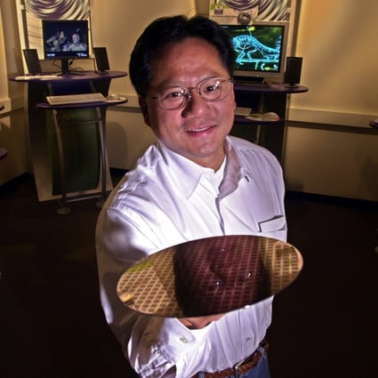 Nvidia Corp chief executive Jensen Huang holds up a silicon wafer at the company’s headquarters in Santa Clara, California. Huang said he has inoculated Nvidia from the worst of any potential crash caused by graphics card use and disposal in cryptocurrency mining. Photo: AP