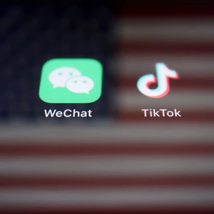 A reflection of the US flag is seen on the signs of the WeChat and TikTok apps in this illustration picture taken September 19, 2020. Photo: Reuters