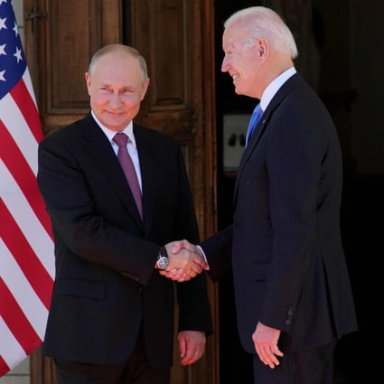 Russian President Vladimir Putin, left, shakes hands with US President Joe Biden during their meeting at the Villa La Grange in Geneva on June 16, 2021. Photo: Sputnik/AFP