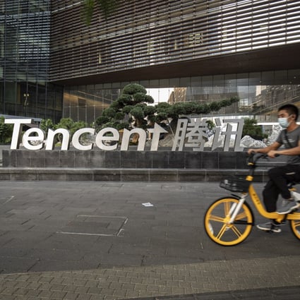 A cyclist rides past Tencent company's headquarters in Shenzhen, China. The company ranks No 5 on the list of most valuable brands in the world. Photo: Bloomberg