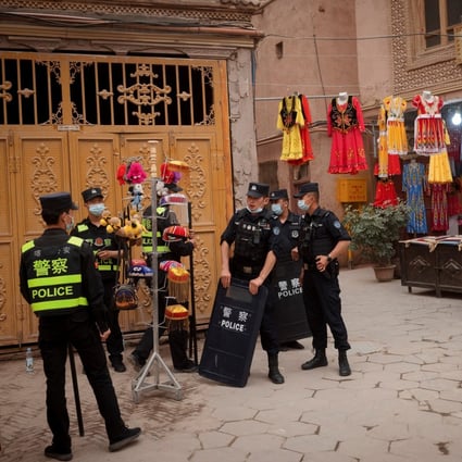 Police officers stand guard in the old city in Kashgar, Xinjiang Uygur autonomous region, China in May. Photo: Reuters