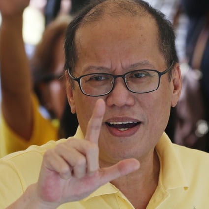 Former Philippine president Benigno Aquino III flashes the ‘L’ sign meaning “Fight!” as he leads a 2018 commemoration of the assassination of his father. Aquino died on June 24 at the age of 61. Photo: AP