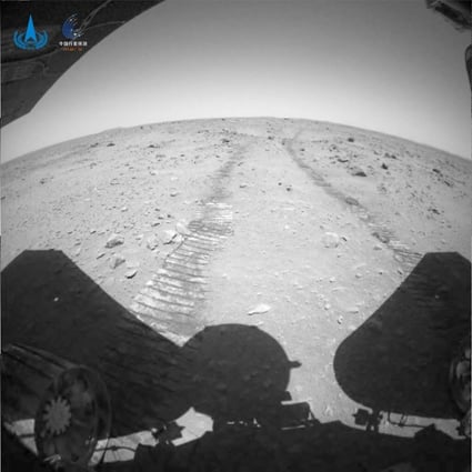 Mars rover Zhu Rong is shown in the video descending to the Martian surface and driving away from its landing platform. Photo: CNSA/Handout via Xinhua